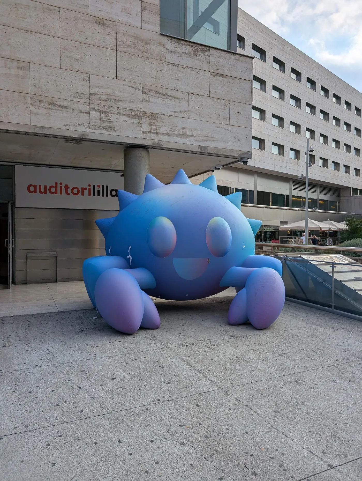 Ferris the Rustacean, but giant and in blue.